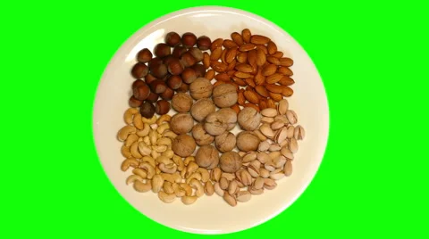 4k – Different nuts on plate Stock Footage 56458235