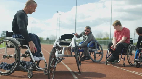 4K Disabled athletes prepare for training session at race track Stock Footage 64575941