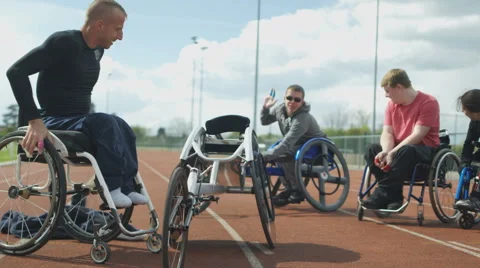 4K Disabled athletes prepare for training session at race track Stock Footage 64576026