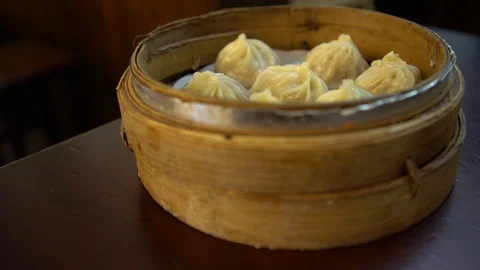 4K Dish dumpling in restaurant. Traditional chinese food served in dim sum-Dan Stock Footage 86093016