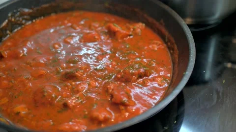 4K dish of pasta cooked to tradition with fresh Italian tomato, tuna, close-up Stock Footage 135311907