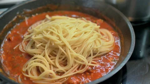 4K dish of pasta cooked to tradition with fresh Italian tomato, tuna, close-up Stock Footage 135311925