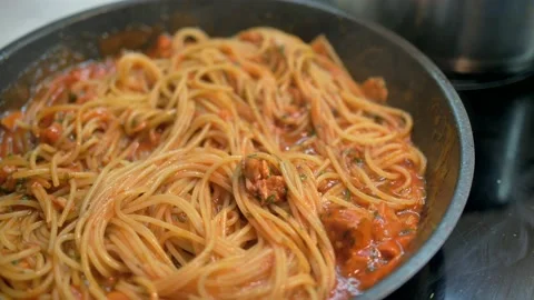 4K dish of pasta cooked to tradition with fresh Italian tomato, tuna, close-up Stock Footage 135312201