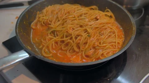 4K dish of pasta cooked to tradition with fresh Italian tomato, tuna, close-up Stock Footage 135312610