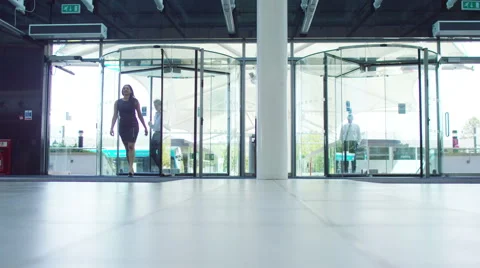 4K Diverse business team walking through lobby area of modern office building Stock Footage