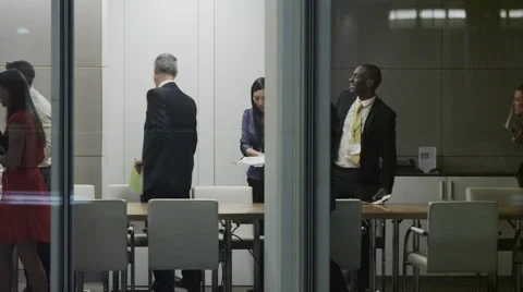 4K Diverse business team working late leave the room at the end of meeting Stock Footage