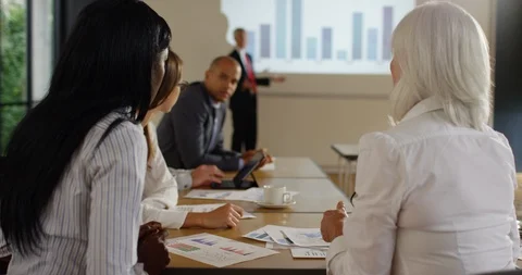 4K Diverse corporate group talking among themselves during business presentation Stock Footage 101404985