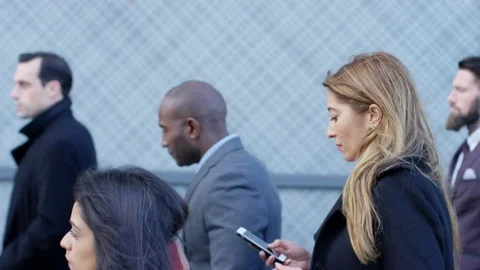 4K Diverse crowd of city workers walking to work in the morning Stock Footage 72717645