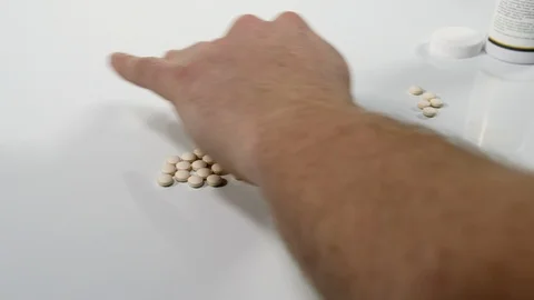 4K Doctors hands sorting medicine pain killer pills, pharmaceuticals Stock Footage 90135202