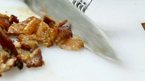 4K Dolly, close up slicing ribs streaky pork on cutting board Stock Footage 83527441