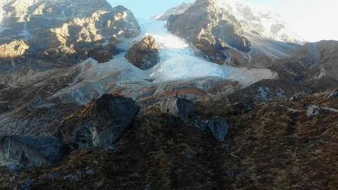 4k dolly out with man in front of big ice fall in Langtang Valley in Nepal Stock Footage 107661824
