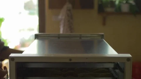 4k dolly putting trays into dehydrator Stock Footage 70996736