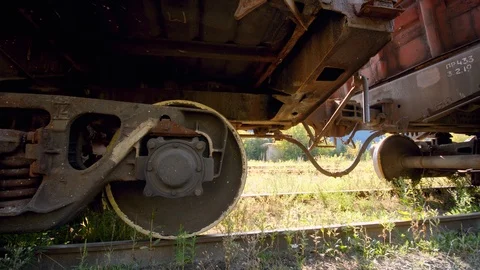 4k dolly video of old rusty cargo train car on abandoned railroad. Concept of Stock Footage 125291583