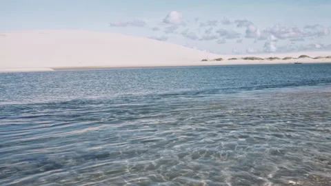 4k down tilt of beautiful young woman reaching for suntan lotion, then applying Stock Footage 199624798