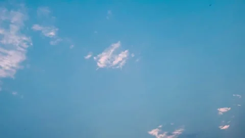 4K Dramatic Blue Cloudscape With Soft Sunlight and Clockwise Rotation Stock Footage 341337364