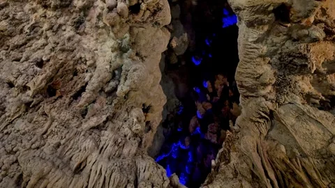 4K Dramatic Blue Glow Deep Inside an Okinawa Limestone Cave Stock Footage 345376042