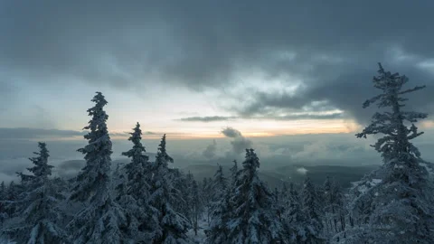 4K Dramatic sunset with high and low clouds over the frozen forest Stock Footage 255529319
