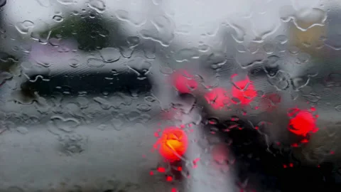 4K drive a car on the road stop with a traffic light with raindrops over the  Stock Footage 156464694