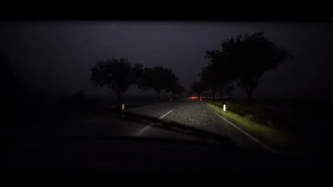 4K driving through heavy rain with thunderstorm during night Stock Footage 117236891