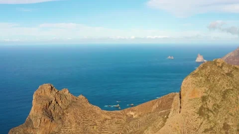 4K drone aerial introducing shot of Roques de Anaga in Park Anaga - Tenerife Stock Footage 197406466