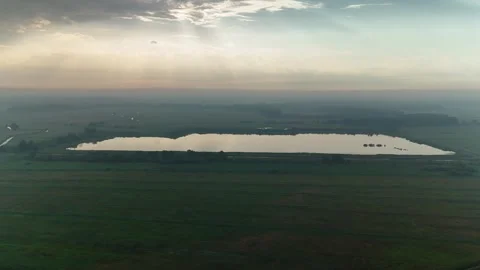 4K Drone Aerial Over Fields and Lake at Sunrise in the Netherlands Stock Footage 317401731