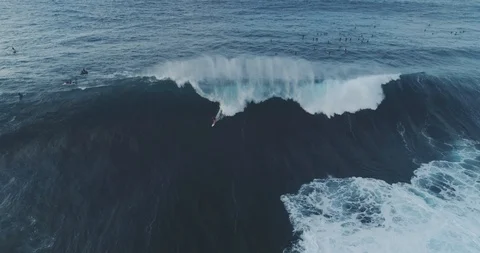 4k Drone Aerial View of Big Wave Surfer in a Giant Barrel at Pe'ahi Hawaii Stock Footage