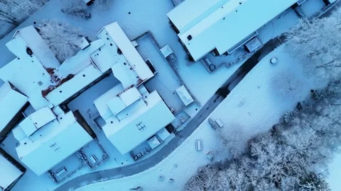 4K Drone Aerial View of Forest Housing Estate Covered in Snow Stock Footage 334840408