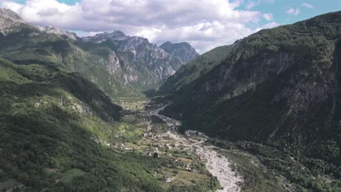 4K drone aerial view of the lush green mountains surrounding Theth, Albania Stock Footage 346923343