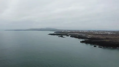 4K drone along the sea cliffs of the Western Anglesey coast towards Holyhead Stock Footage 272222306