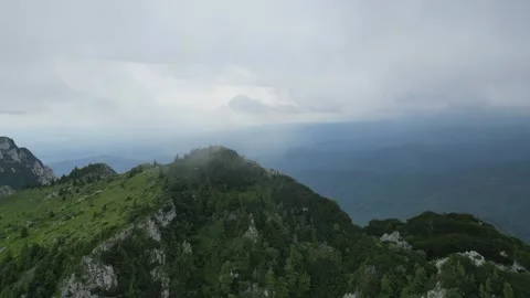 4K drone approach to mountain peak in fog – dramatic misty landscape Stock Footage 344550964