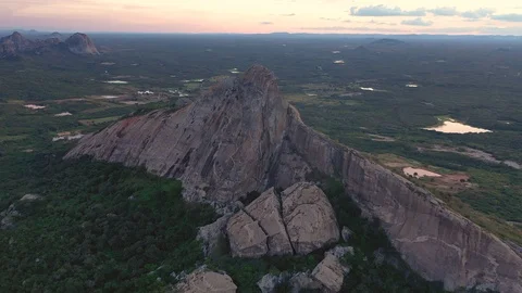 4K Drone approaching out of a huge and shaped rock in a valley, Brazil.  Video stock 119797422