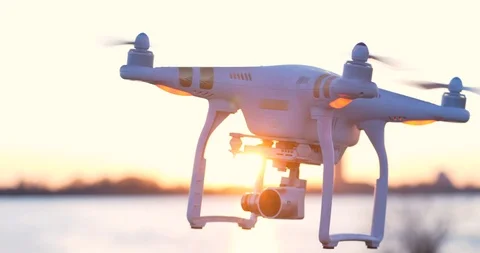 4K - Drone on a background of the sun. Quadcopter close-up Stock Footage 106677266