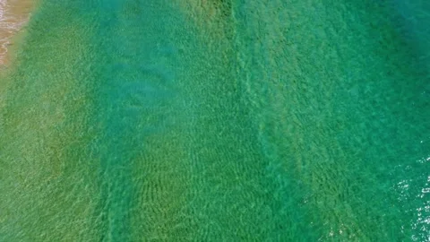 4K Drone Beach with Textured Sand and Clear Water Stock Footage 331622972