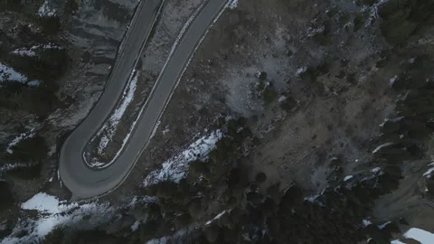 4K Drone Bird’s-Eye View Revealing Hairpin Mountain Roads and Forested Cliff Video stock 327968028