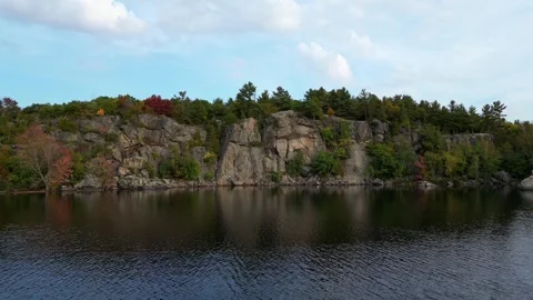 4K Drone Cinematic Flying Over A Picturesque Rock On The Shore Of McCrae Lake Stock Footage 256726152