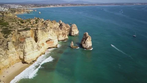 4k drone - Cliffs &amp; Rocks of Praia do Camilo Beach. Lagos, Portugal.  Algarve. Stock Footage 82556113
