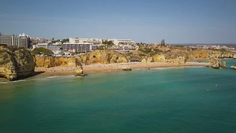 4k drone - Cliffs &amp; rocks of Praia Dona Ana beach.  Lagos, Portugal.  Algarve Stock-Footage 82556370