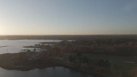 4k drone coastal golf course at sunset, camera moves left to right Stock Footage 290939443