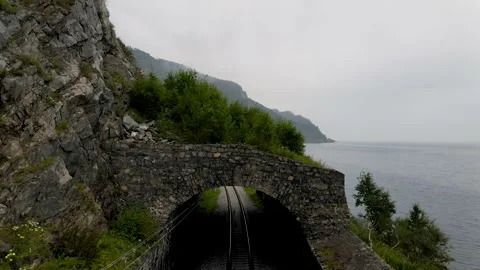 4K The drone descends on the train tracks in front of the old tunnel. Stock Footage 159386804