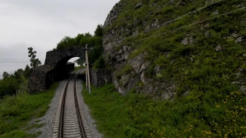 4K The drone descends on the train tracks in front of the old tunnel. Video stock 159663552