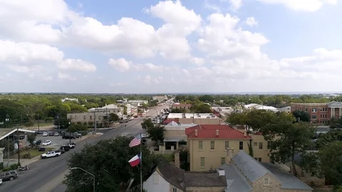 4k Drone Dolly Left Texas Flag Fredericksburg Video stock 118399000