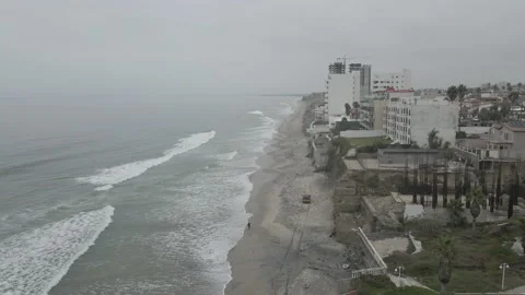 4K DRONE Fire Truck Driving North on Tijuana Beach Towards San Diego Border Stock Footage 219672111