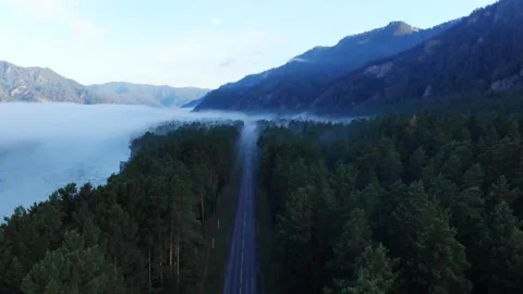 4k Drone flight - Mountain Road and forest at Sunrise Stock Footage 202106978