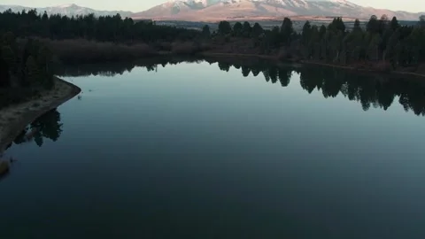 4K drone flight over a beautiful lagoon revealing mountains at the bg Stock Footage 249753671