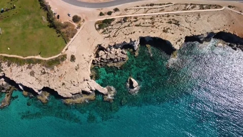 4K drone flight over the blue crystal clear sea and rocky cliffs, Cyprus Stock Footage 237356628