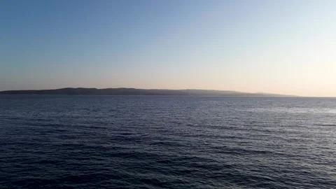 4K Drone Flight Over Calm Evening Sea Toward Croatian Islands Near Brela Beaches Stock Footage 312689275
