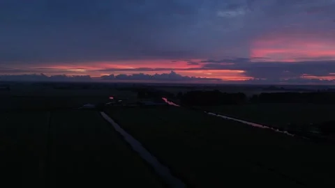 4K Drone Flight Over Dark Land and Bright Sunrise 動画素材 317403426