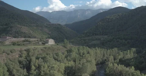 4K Drone Flight over farm house Spanish Pyrenees Ungraded Stock Footage 68905973