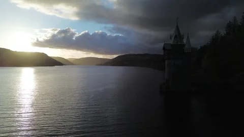 4K Drone Flight Over Lake in Wales at Sunset with Rolling Hills Видео 333957623