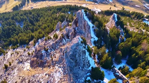4K Drone flight over rugged alpine rock formation Stock Footage 329854408